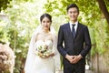 Outdoor portrait of a newly-wed asian couple Royalty Free Stock Photo