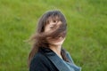 Outdoor portrait of beautiful girl laughing while the wind moves Royalty Free Stock Photo