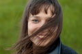 Outdoor portrait of beautiful girl laughing while the wind moves Royalty Free Stock Photo