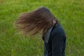 Outdoor portrait of beautiful girl laughing while the wind moves Royalty Free Stock Photo