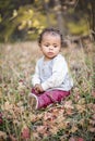 Outdoor Portrait of a beautiful serene mixed race little boy