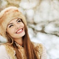 Outdoor portrait of beautiful smiling girl looking at copy space Royalty Free Stock Photo