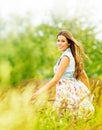 Outdoor Portrait of Beautiful Young Woman in Nature. Attractive Girl in Summer Green Field Royalty Free Stock Photo