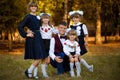 Outdoor portrait of big happy family with one brother and four sisters. Royalty Free Stock Photo