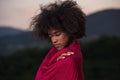 Outdoor portrait of a black woman with a scarf Royalty Free Stock Photo