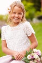 Outdoor Portrait Of Bridesmaid Holding Bouquet Royalty Free Stock Photo