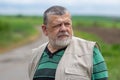 Outdoor portrait of Caucasian senior man with intent look