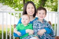 Outdoor Portrait of A Chinese Mother with Her Two Mixed Race Chinese and Caucasian Young Boys