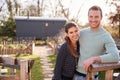 Outdoor Portrait Of Couple Spending Vacation In Eco Lodge