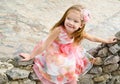 Outdoor portrait of cute sitting little girl Royalty Free Stock Photo