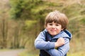 Outdoor portrait of cute young boy