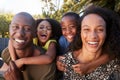 Outdoor Portrait Of Family In Garden At Home Against Flaring Sun Royalty Free Stock Photo