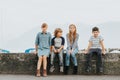 Outdoor portrait of 4 fashion kids Royalty Free Stock Photo