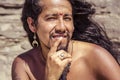 Outdoor portrait of fashionable long hair young man