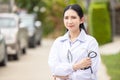 Outdoor Portrait Female Doctor Holding Stethoscope, Hospital worker standing Royalty Free Stock Photo