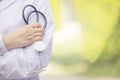 Outdoor Portrait Female Doctor Holding Stethoscope, Hospital worker standing Royalty Free Stock Photo