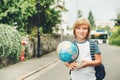 Outdoor portrait of funny little schoolboy Royalty Free Stock Photo