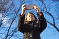 Outdoor portrait girl child of 8, 9 years old with smartphone Royalty Free Stock Photo