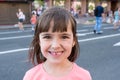 Outdoor portrait of a girl smeared in ice cream. Close-up