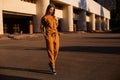 Outdoor portrait of girl in sport costume walking city streets Royalty Free Stock Photo