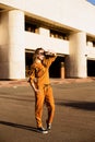 Outdoor portrait of girl in sport costume walking city streets Royalty Free Stock Photo