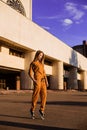 Outdoor portrait of girl in sport costume walking city streets Royalty Free Stock Photo