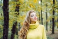 Outdoor portrait Gorgeous brunette model girl with sunny day light. Autumn woman having fun at the park and smiling Royalty Free Stock Photo