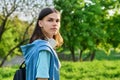 Outdoor portrait of handsome student guy with backpack looking at camera, copy space Royalty Free Stock Photo