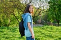 Outdoor portrait of handsome student guy with backpack looking at camera Royalty Free Stock Photo