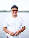 Outdoor portrait of a handsome young man in jeans and white t-shirt. Royalty Free Stock Photo