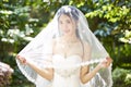 Outdoor portrait of happy asian bride Royalty Free Stock Photo