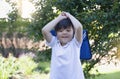 Outdoor portrait of happy child boy with school bag, Cute kid waiting for a bus, Pupil of primary going to school, Back to school