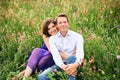 Outdoor portrait of happy couple enjoying nice warm evening