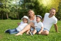 Outdoor portrait happy family Mother father and children son in home green garden Royalty Free Stock Photo