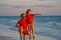 Outdoor portrait of happy father and son walking on sunny ocean beach. Father and son walk in sea beach. Concept of Royalty Free Stock Photo