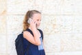 Outdoor portrait of happy girl 8-9 year old talking on phone. Royalty Free Stock Photo