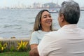 Outdoor portrait of a happy middle-aged couple in the park Royalty Free Stock Photo