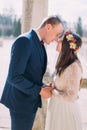 Outdoor portrait of happy sensual wedding couple embracing. Beautiful young bride going to kiss with handsome groom Royalty Free Stock Photo