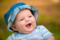 Outdoor portrait of happy smiling infant