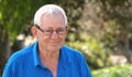 Outdoor portrait of happy, smiling senior man wearing eye glasses Royalty Free Stock Photo