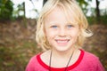 Outdoor portrait of a happy young boy