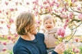 Outdoor portrait of happy young father playing with adorable toddler girl Royalty Free Stock Photo