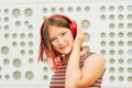 Outdoor portrait of pretty teenage girl with red dyed hair Royalty Free Stock Photo