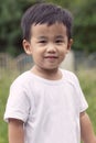 Outdoor portrait head shot of asian children smiling face looki