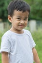 outdoor portrait head shot of asian children smiling face looking with eyes contact to camera