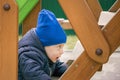 Interested boy walking stairs on playground