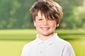 Outdoor portrait of joyful ten years old boy Royalty Free Stock Photo