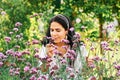 Outdoor portrait of middle age woman in sunny garden Royalty Free Stock Photo