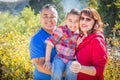 Outdoor Portrait of Mixed Race Caucasian and Hispanic Family. Royalty Free Stock Photo