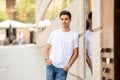 Outdoor portrait of modern attractive young man in the city. Urban background Royalty Free Stock Photo